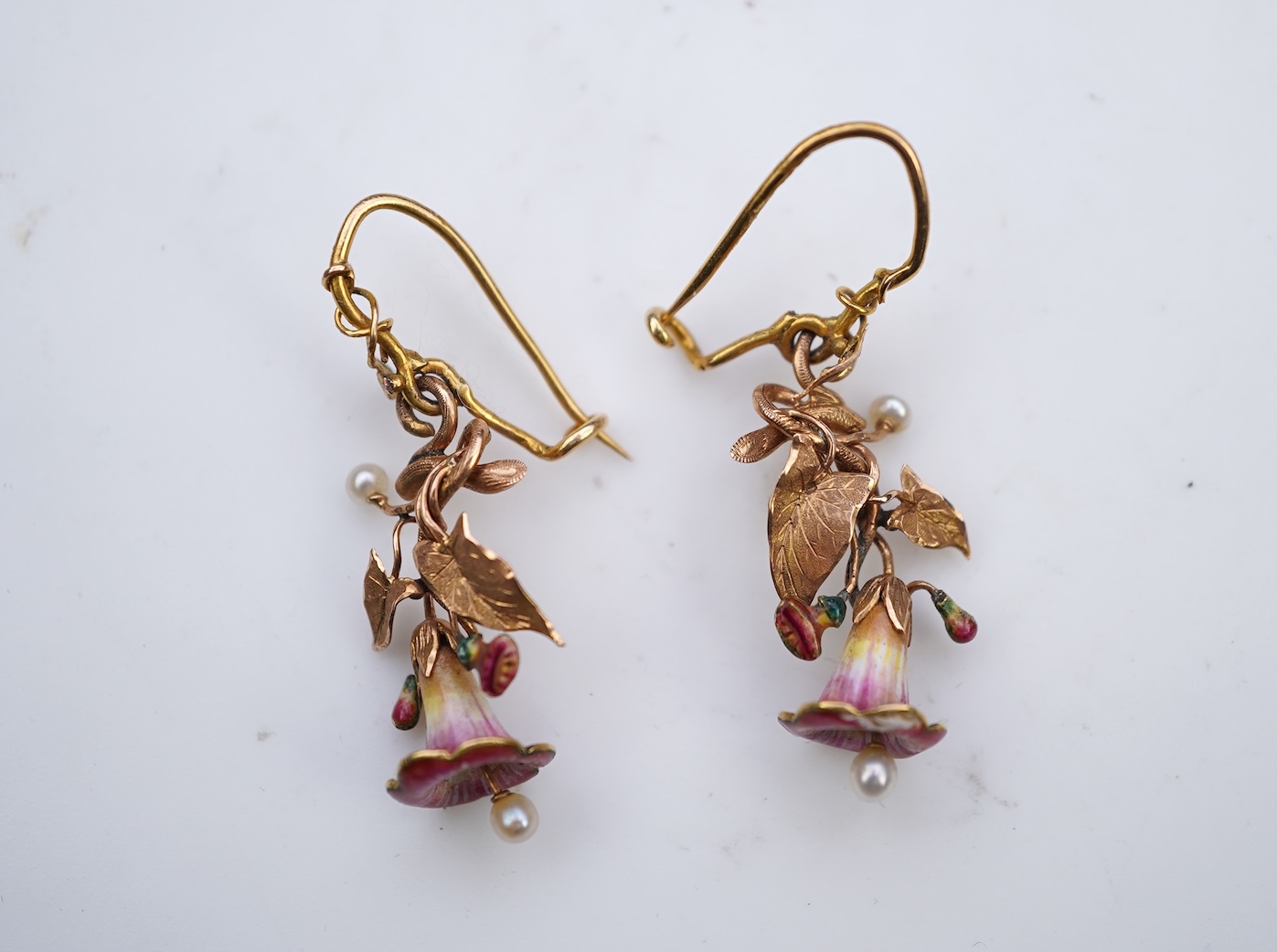A rare pair of naturalistic gold, enamel and seed pearl earrings, circa 1850